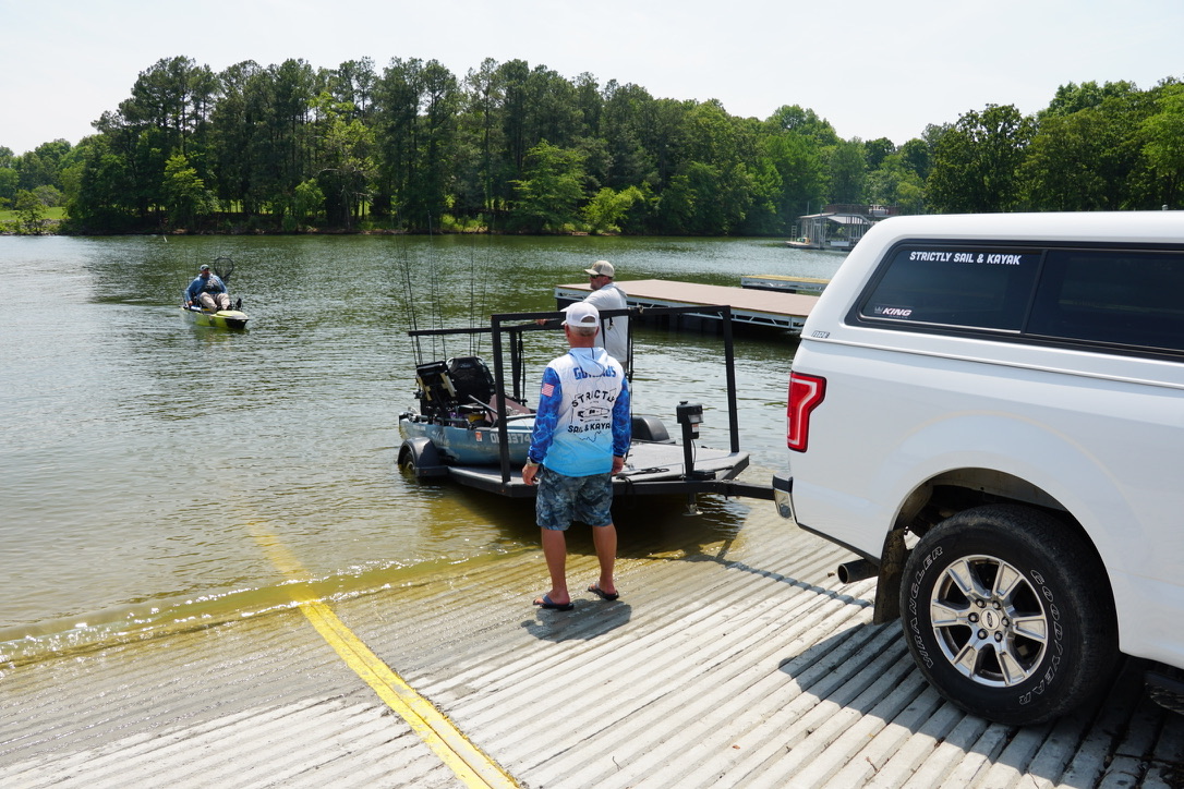 CKF anglers launching kayaks at the ramp