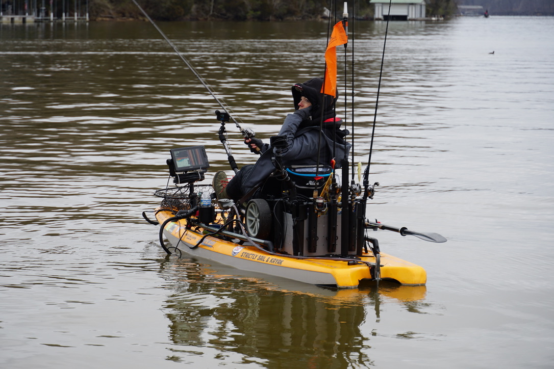 Kayak angler competing on a calm lake