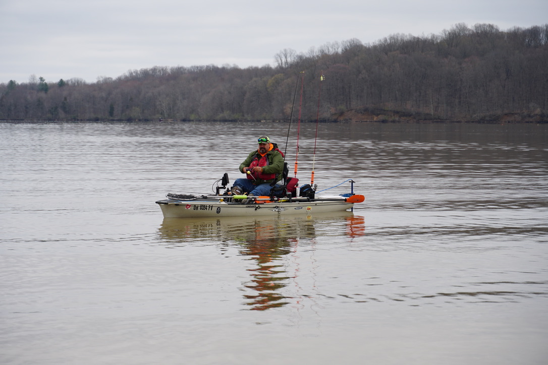 Kayak angler fishing across open water